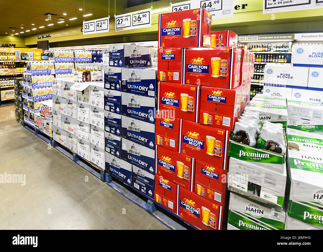 Cartons of beer on display at Dan Murphy's Liquor Store, Shellharbour, New South Wales, NSW, Australia Stock Photo