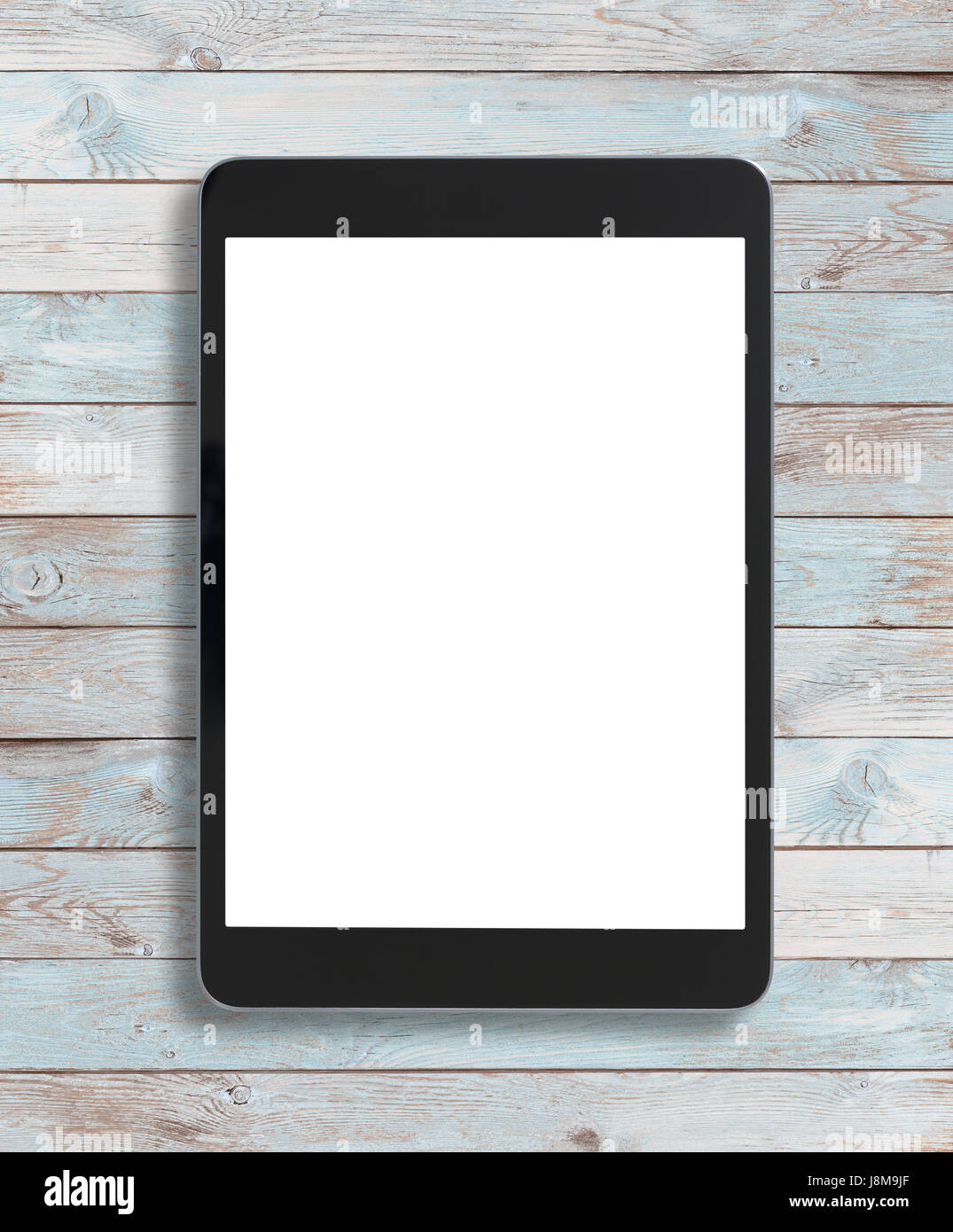 Black tablet pc on old wood background Stock Photo