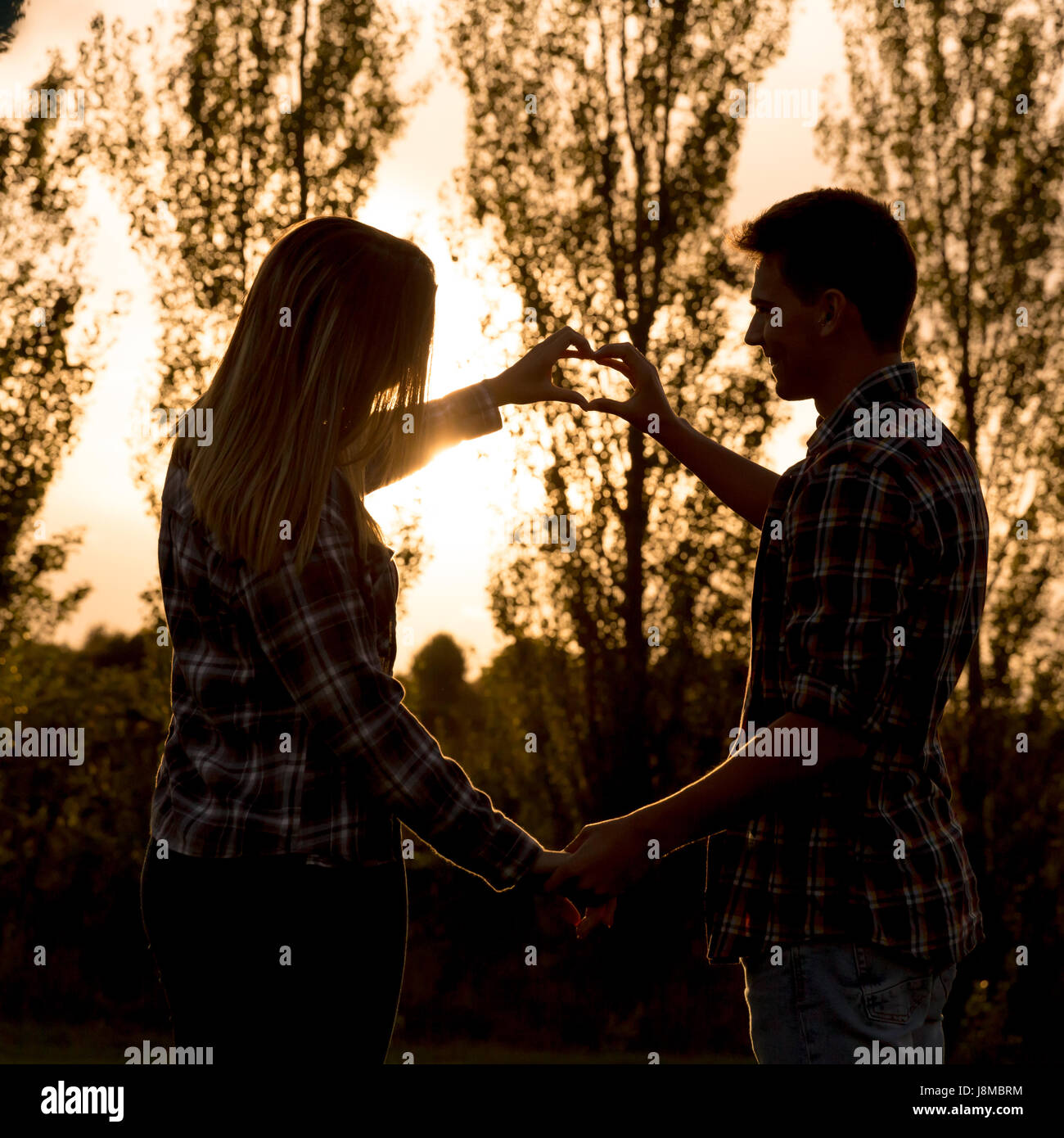 Young couple in love making promises of love Stock Photo