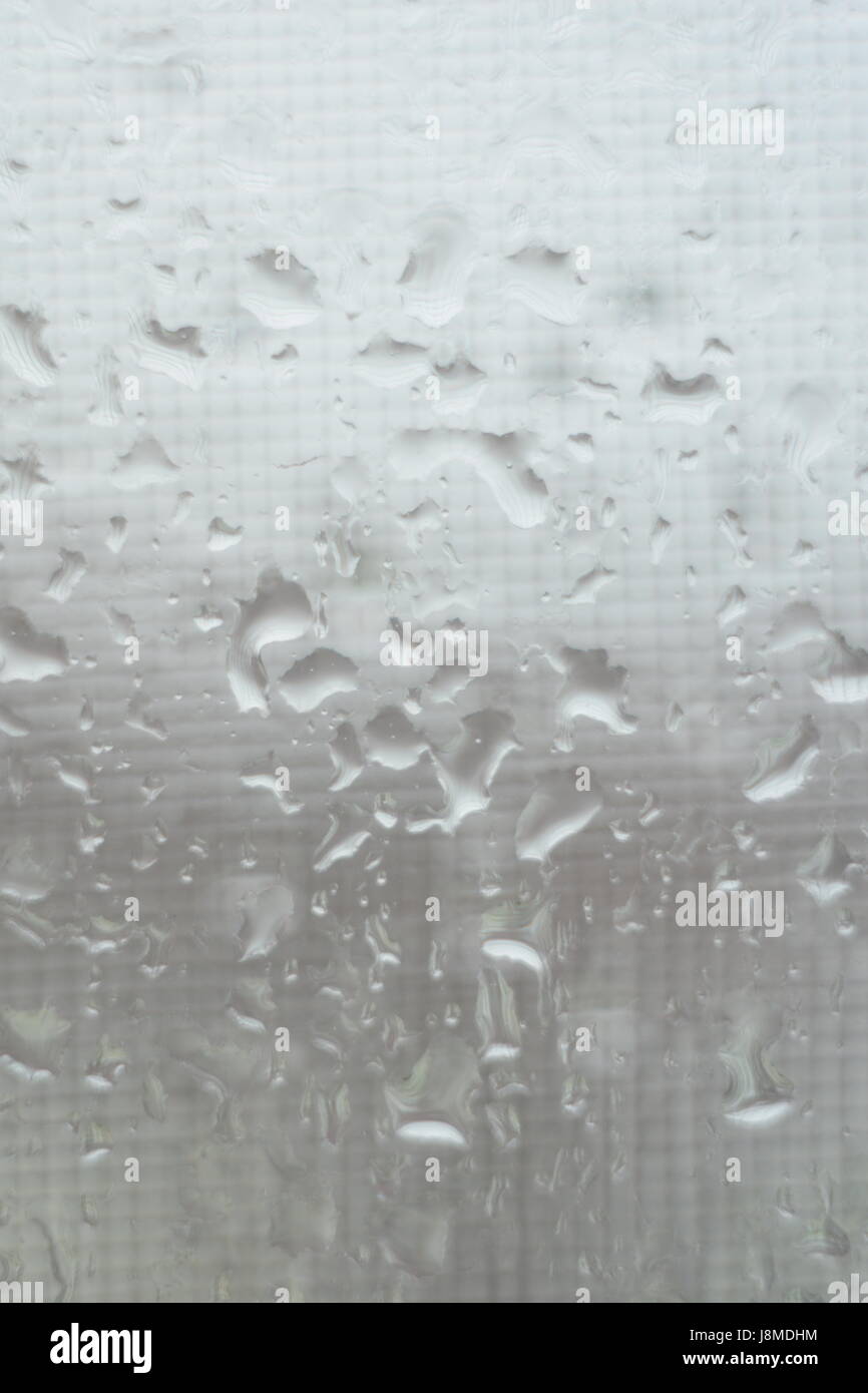 Rain drops on window glasses surface with cloudy background Stock Photo ...