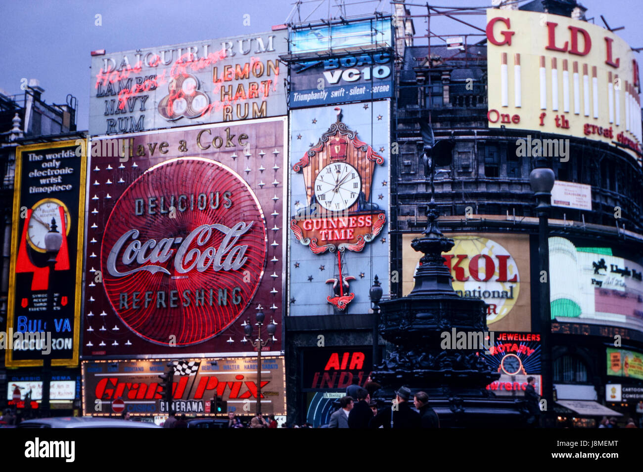 Vintage image of Piccadilly Circus in London taken in April 1967 showing various billboards of the time including Coca Cola, Guiness, Skol Stock Photo