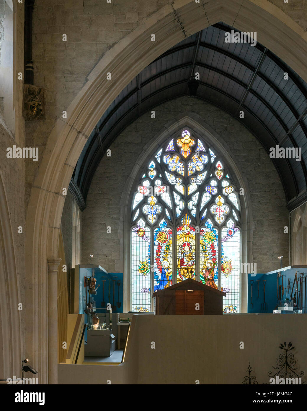 Pointed arches and stained glass window. Garden Museum Lambeth Palace