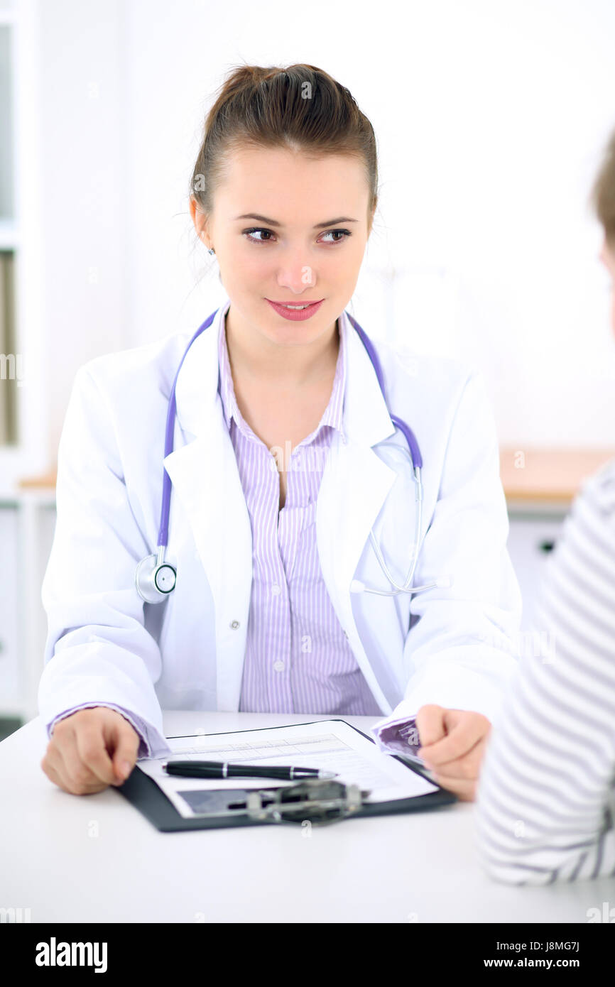 Young female doctor listen to patient story carefully. Medical and