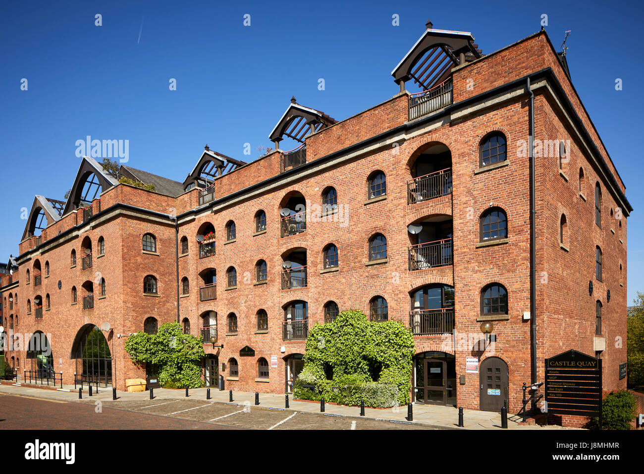 One of the original urban city living mill conversions into lofts, Castle Quay development mill Castlefield , Gtr Manchester, UK. Stock Photo