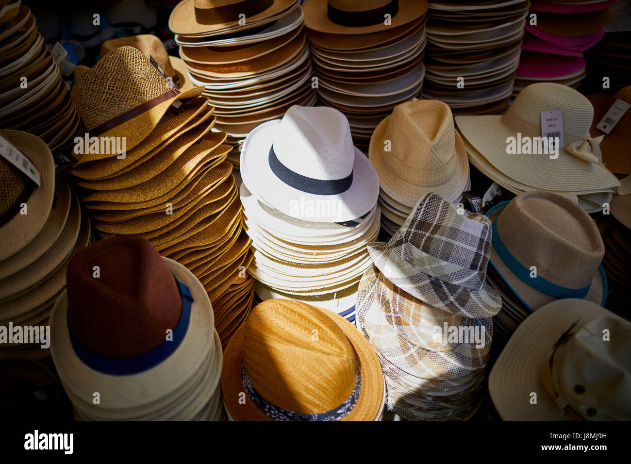 Man hats for sale in an outdoor market, Santorini, Greece Stock Photo -  Alamy