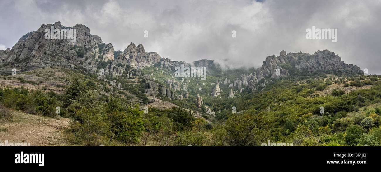 Clouds over The rock formations of the Demerdji mountain. Valley of Ghosts. Landscape of Crimea, Russia. Ukraine Stock Photo