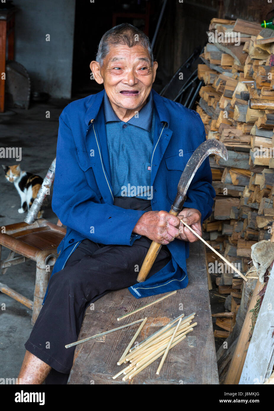 Yubei, Zhejiang, China.  Old Man Making Chopsticks. Stock Photo