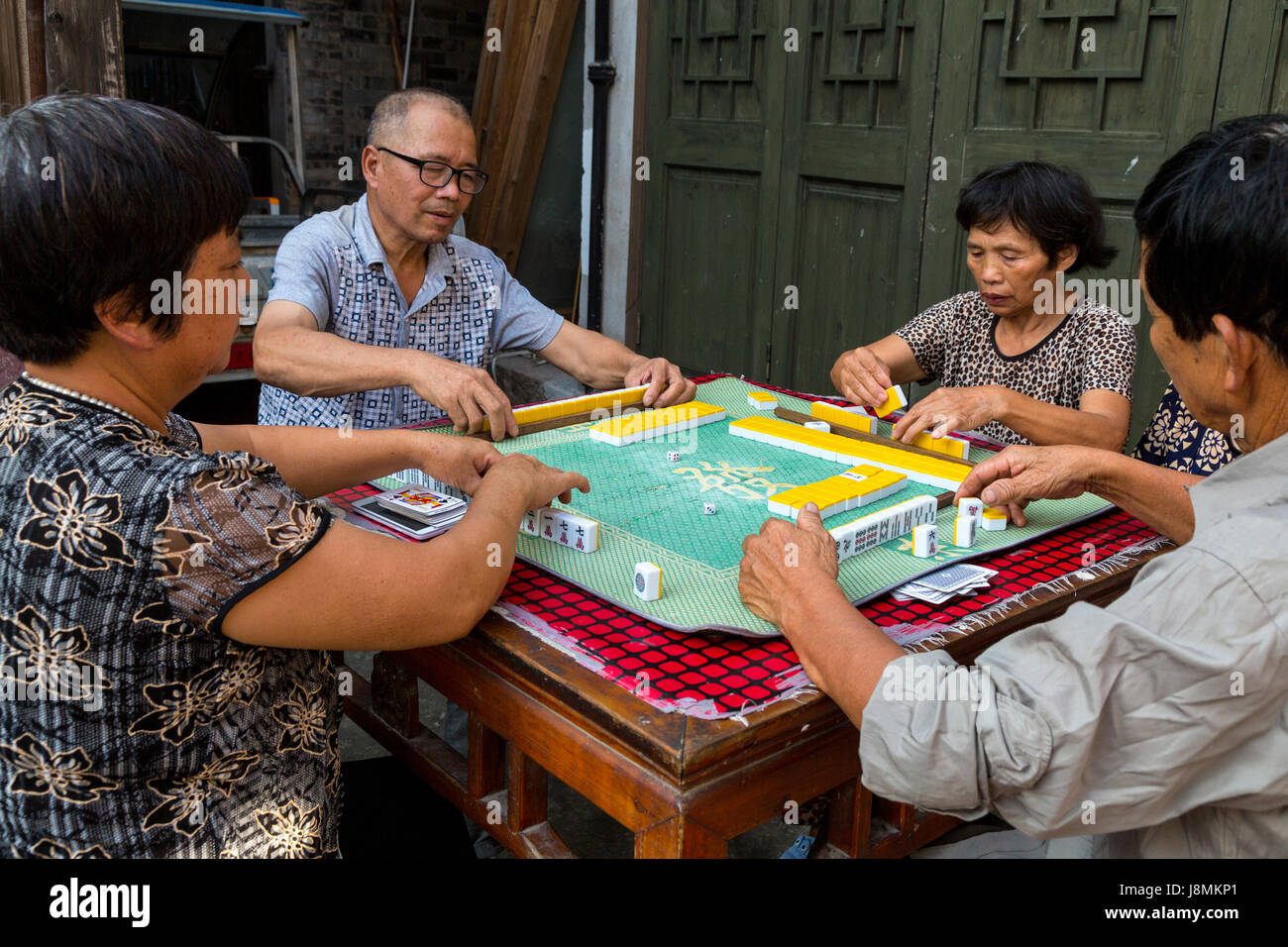 Cangpo, Zhejiang, China.  Local Residents Playing Mahjong. Stock Photo