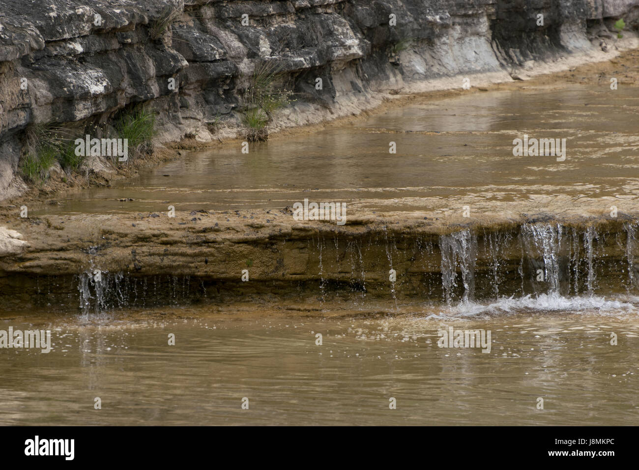 Crystal clear waters of Cow Creek in the South Texas Hill Country flowing peacefully over a