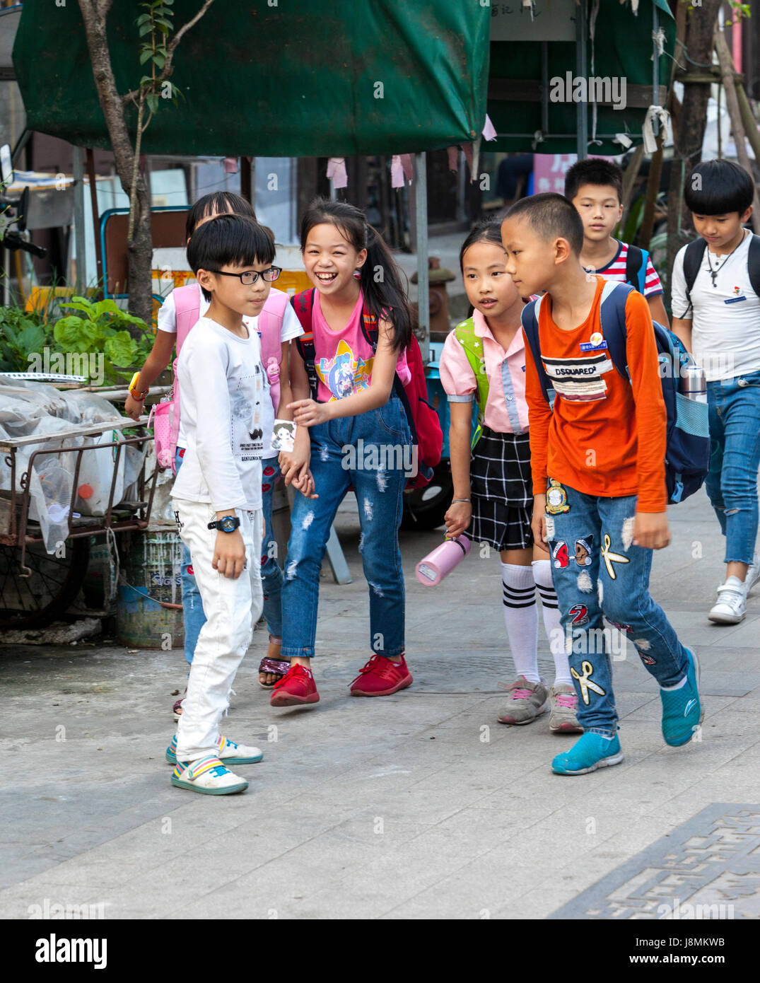 Yantou, Yongjia, Zhejiang, China.  Children Walking Home after School. Stock Photo