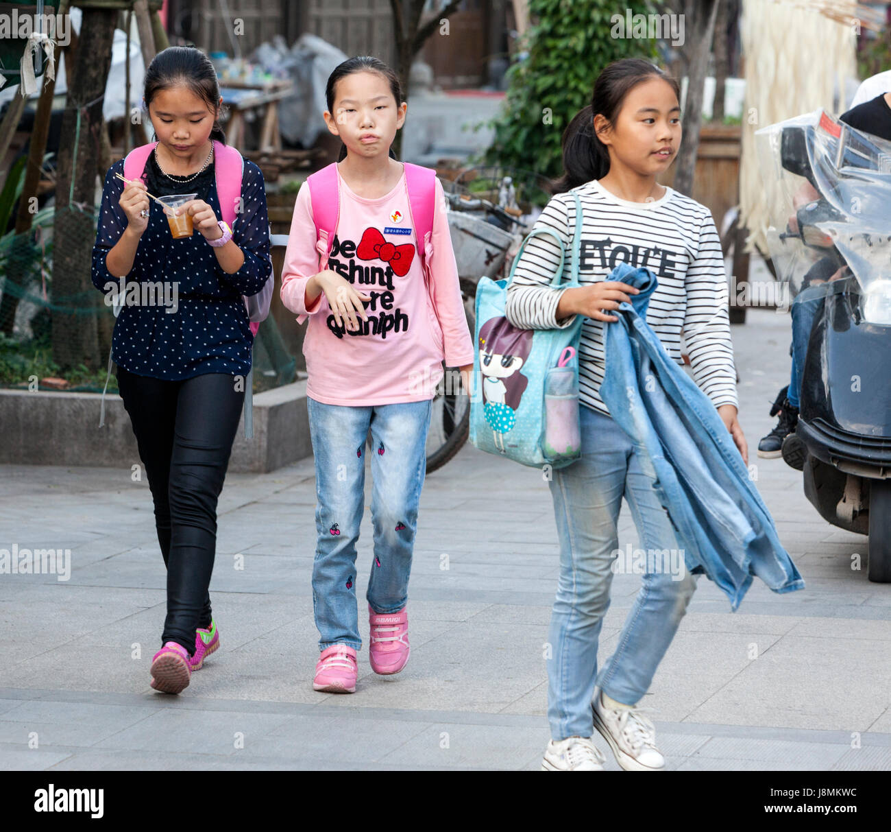 Yantou, Yongjia, Zhejiang, China.  Teenage Girls Walking Home after School. Stock Photo