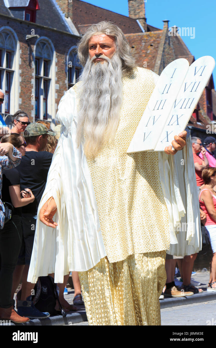 Moses holding a tablet with the Ten Commandments during the Procession of the Holy Blood in Bruges, Belgium Stock Photo