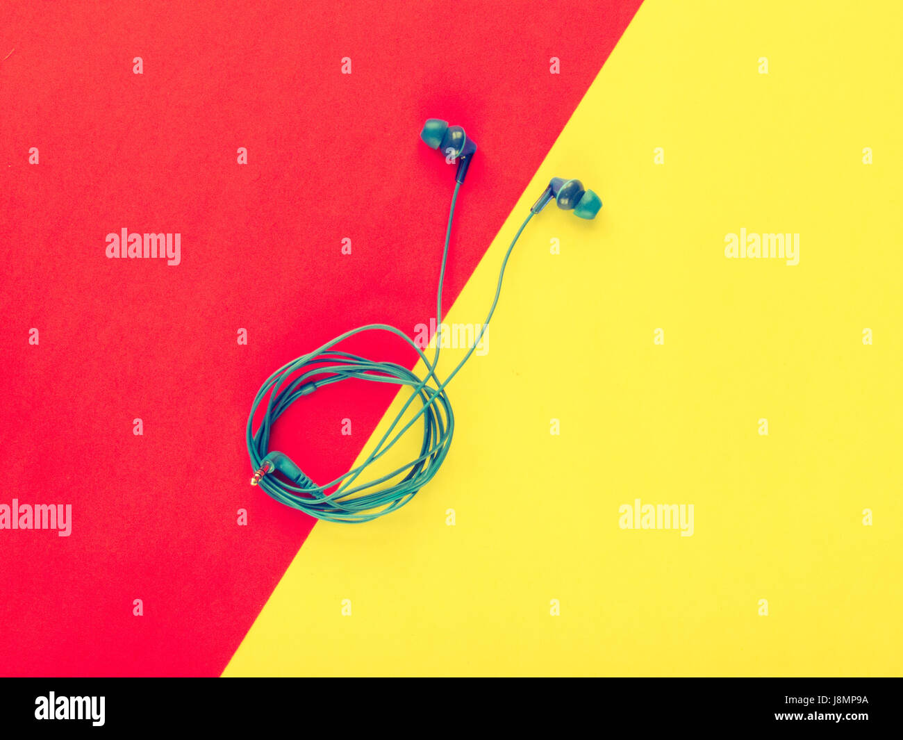Blue headphones on a colorful pastel background Stock Photo Alamy