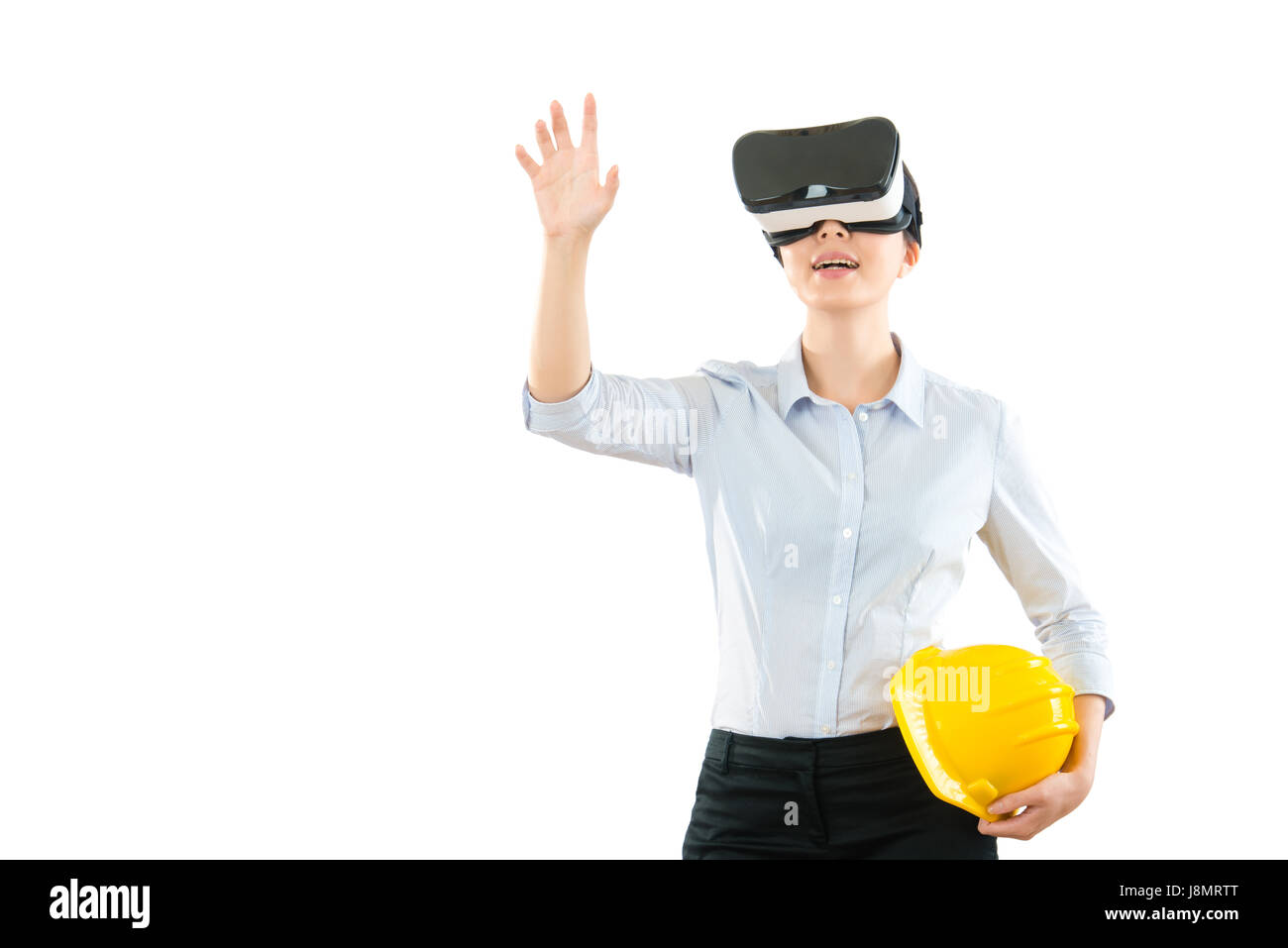 young woman using a virtual reality headset with architecture site work ...
