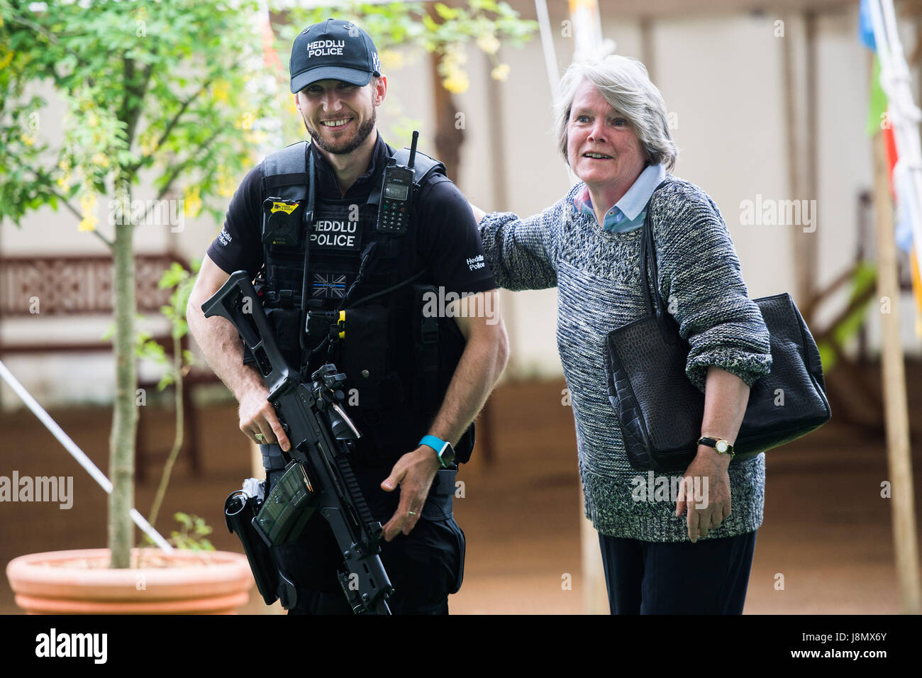 Hay Festival, Wales UK, Monday 29 May 2017 Armed police officers patrolling the site of the 2017 Hay Festival on Bank Holiday Monday Now in its 30th year, the festival draws tens of thousand of visitors a day to what was described by former US president Bill Clinton as 'the woodstock of the mind' Photo credit Credit: keith morris/Alamy Live News Stock Photo