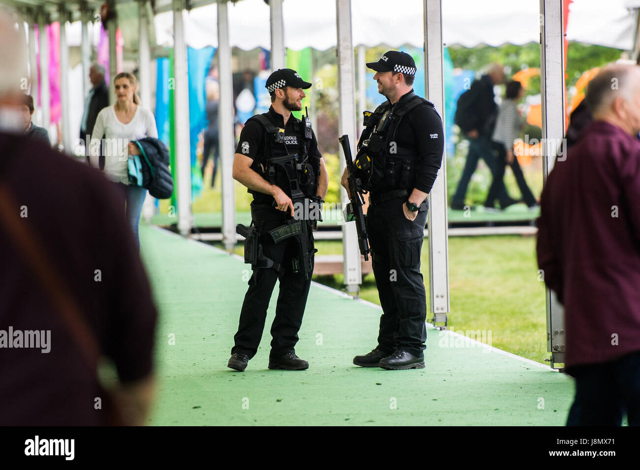 Hay Festival, Wales UK, Monday 29 May 2017 Armed police officers patrolling the site of the 2017 Hay Festival on Bank Holiday Monday Now in its 30th year, the festival draws tens of thousand of visitors a day to what was described by former US president Bill Clinton as 'the woodstock of the mind' Photo credit Credit: keith morris/Alamy Live News Stock Photo