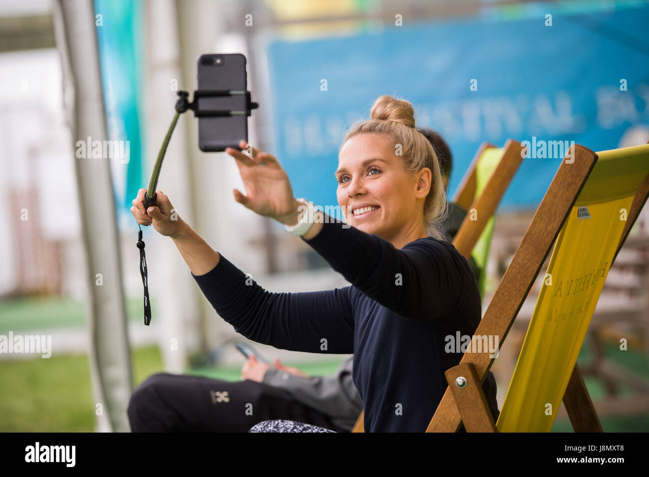Hay Festival, Wales UK, Monday 29 May 2017 A young woman takes a selfie at the 2017 Hay Literature festival Now in its 30th year, the festival draws tens of thousand of visitors a day to what was described by former US president Bill Clinton as 'the woodstock of the mind' Photo credit Credit: keith morris/Alamy Live News Stock Photo