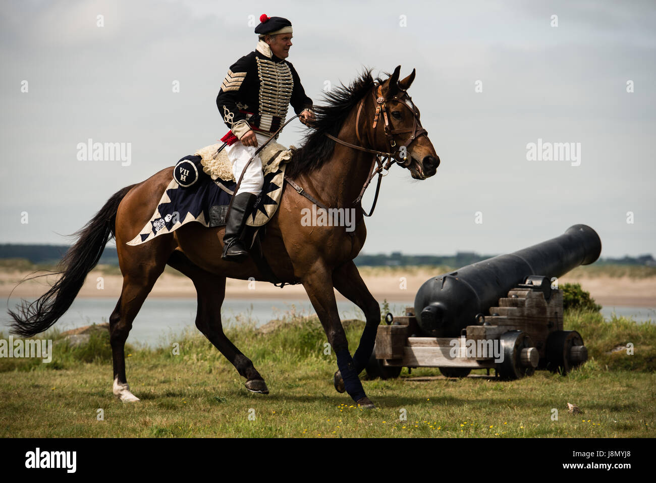 Fort Belan, Gwynedd. 28th May, 2017. Ian Walker, a member of the Anglesey Hussars rides his war horse as part of the Cavalry and Infantry Displays at Fort Belan over the Bank Holiday weekend. Credit: Michael Gibson/Alamy Live News Stock Photo