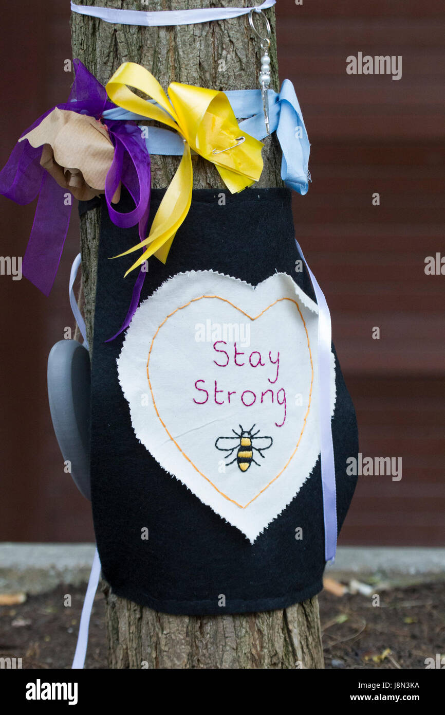 Manchester, UK. 29th May, 2017. Sign saying stay strong with Manchester Bee logo at Manchesters St Ann's square, one week on from bombing in Manchester . St Ann's square. Manchester. Credit: GARY ROBERTS/Alamy Live News Stock Photo
