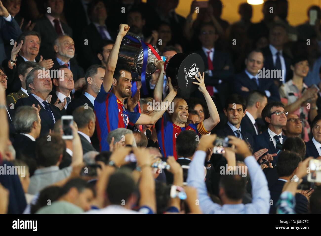 Madrid, Spain. 27th May, 2017. (L-R) Sergio Busquets, Andres Iniesta (Barcelona) Football/Soccer : Busquets and Iniesta celebrate after winning Spanish 'Copa del Rey' match between Deportivo Alaves 1-3 FC Barcelona at the Vicente Calderon stadium in Madrid, Spain . Credit: Mutsu Kawamori/AFLO/Alamy Live News Stock Photo