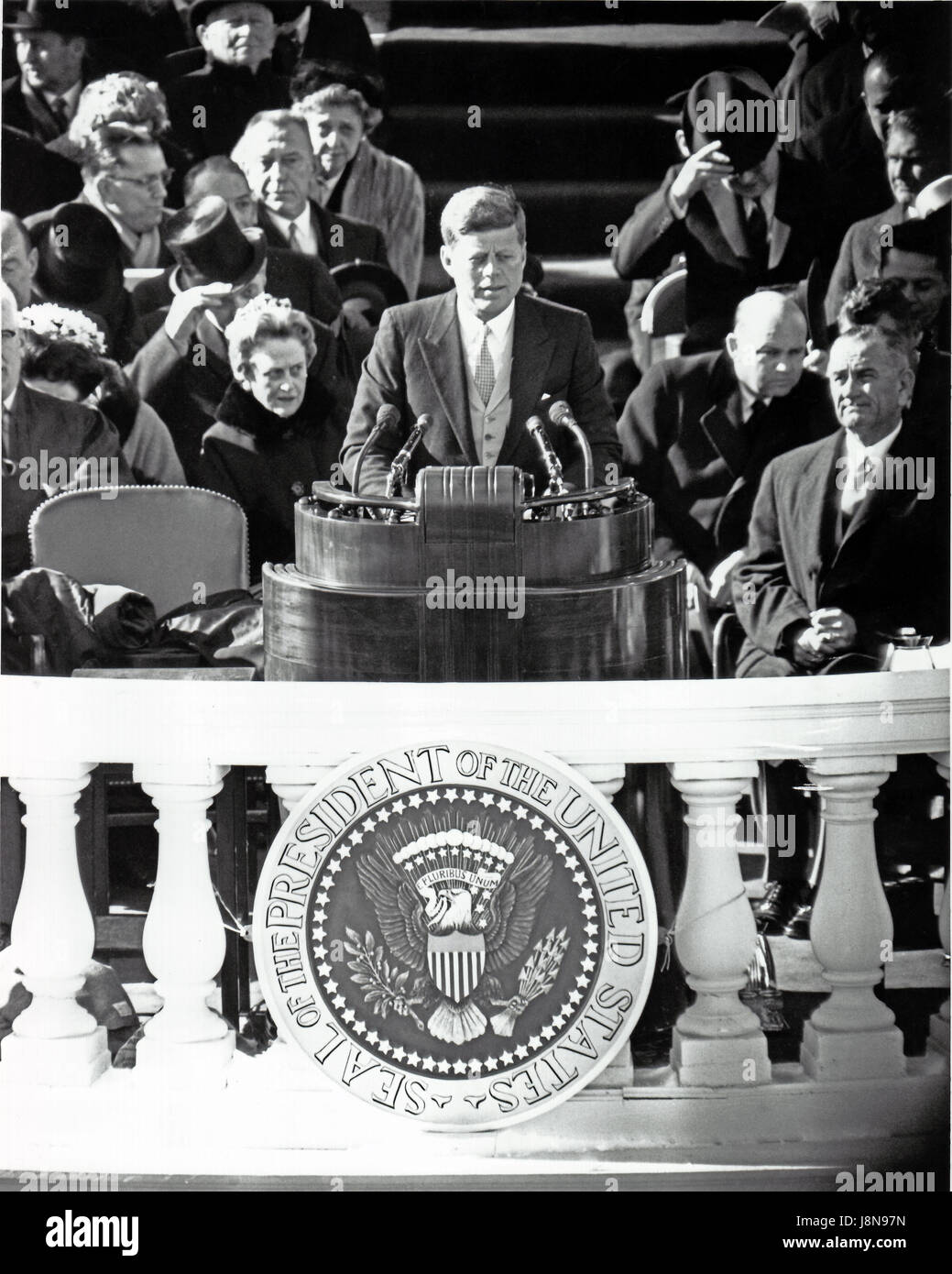 United States President John F. Kennedy delivers his Inaugural Address after being sworn-in as the 35th President of the United States on the East Front of the U.S. Capitol in Washington, D.C. on Friday, January 20, 1961.  U.S. Vice President Lyndon B. Johnson looks on from right..Credit: Arnie Sachs / CNP /MediaPunch Stock Photo