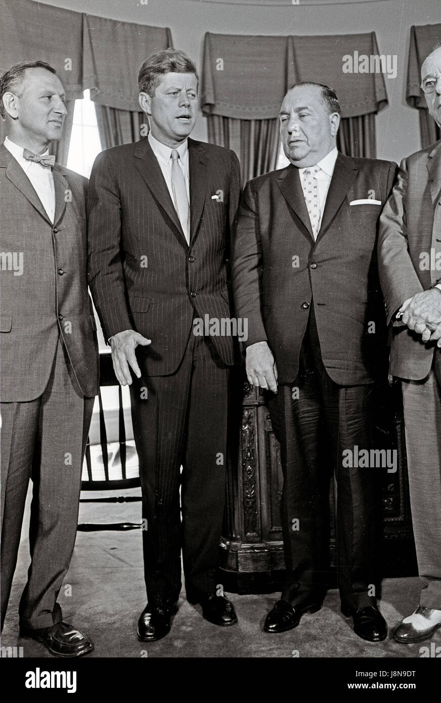 United States President John F. Kennedy meets Mayor Richard J. Daley (Democrat of Chicago) and officials from Illinois in the Oval Office of the White House in Washington, DC on July 11, 1962. From left to right: US Representative Sidney R. Yates (Democrat of Illinois); President Kennedy; Mayor Daley; US Representative Thomas J. O'Brien (Democrat of Illinois). Credit: Arnie Sachs/CNP /MediaPunch Stock Photo