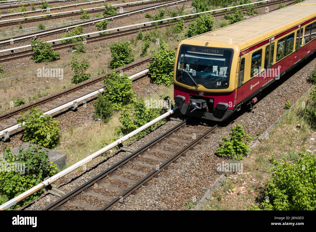 Berlin, Germany - may 27, 2017: S-Bahn train on multi lane rail / railroad network at Berlin Olympiastadion ( olympic Stadium). Stock Photo