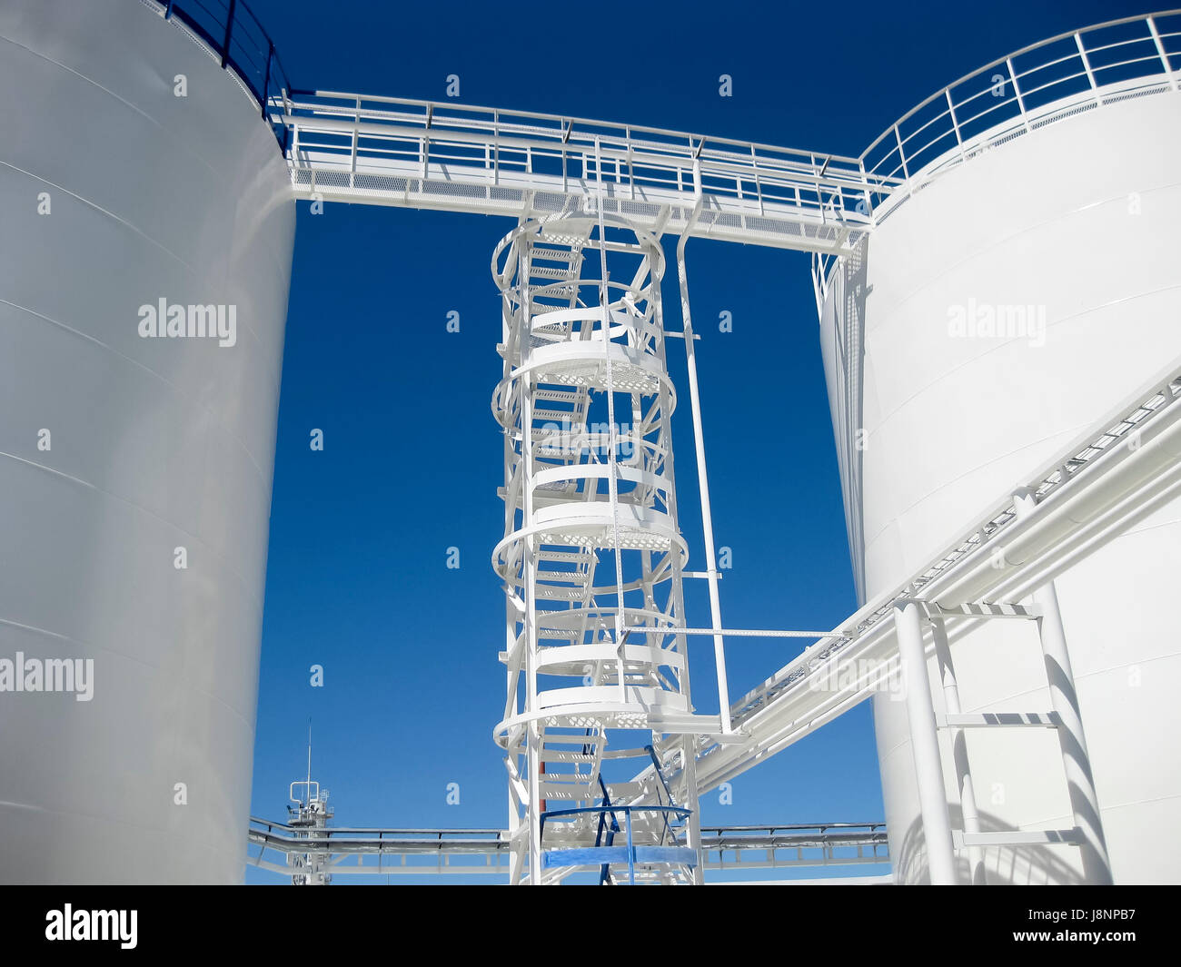 Tank Rack Refinery The tank with water and a ladder. Oil refinery. Equipment for primary ...