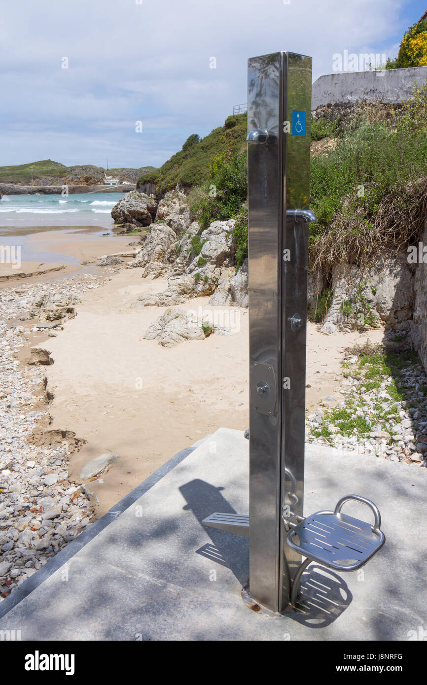 A shower stand by a beach in northern Spain with facilities for disabled users. Stock Photo