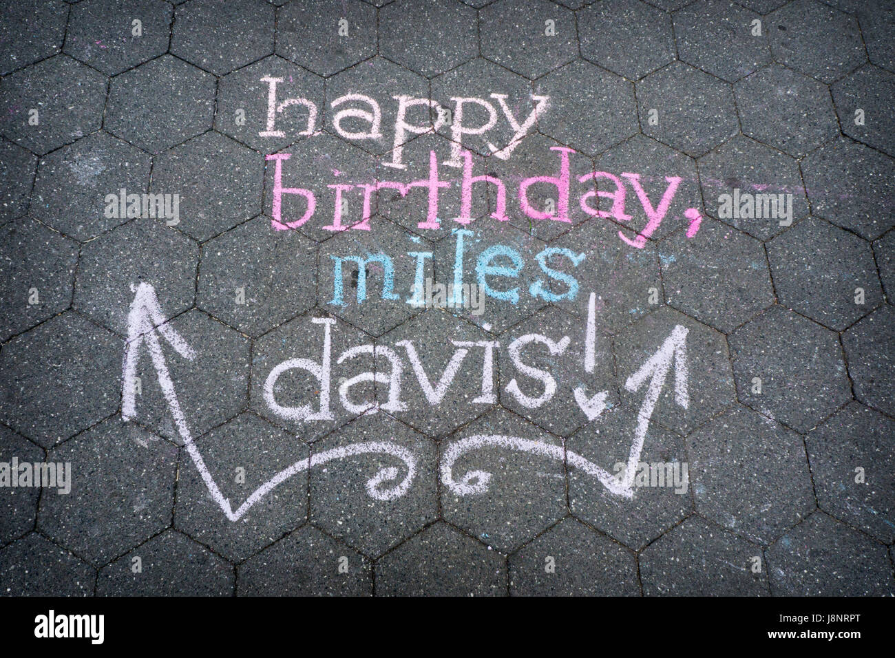 Happy birthday Miles Davis drawn in chalk on the ground in Washington Square Park in Greenwich Village, Manhattan, New York City Stock Photo