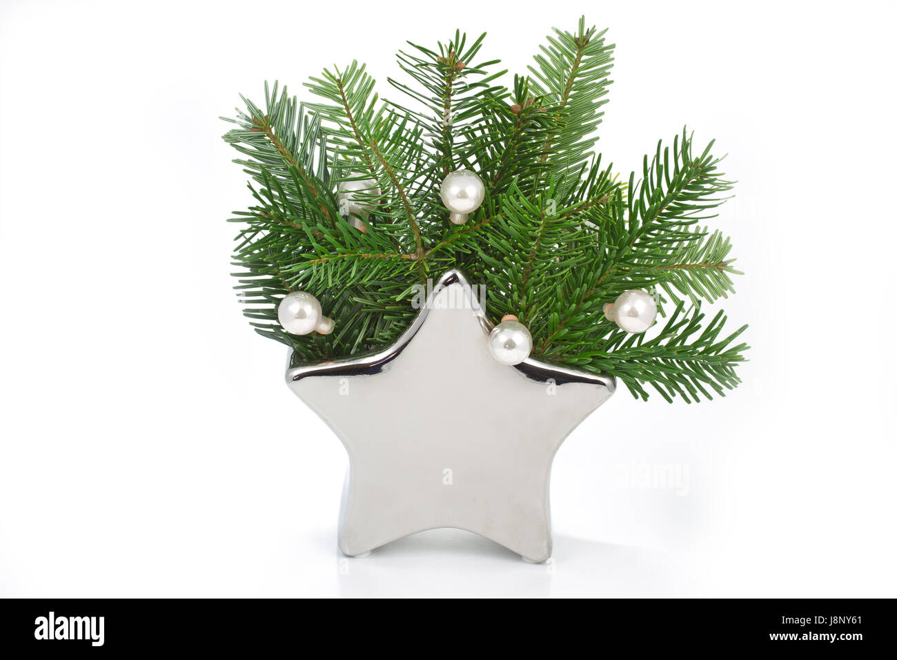 of fir in a star-shaped vase Stock Photo