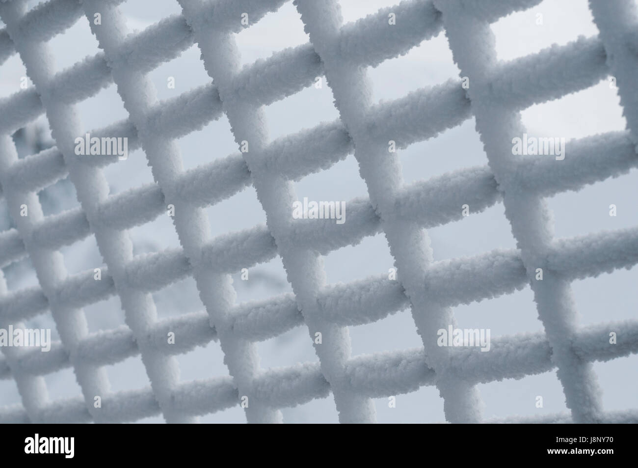 Snow on grating Stock Photo