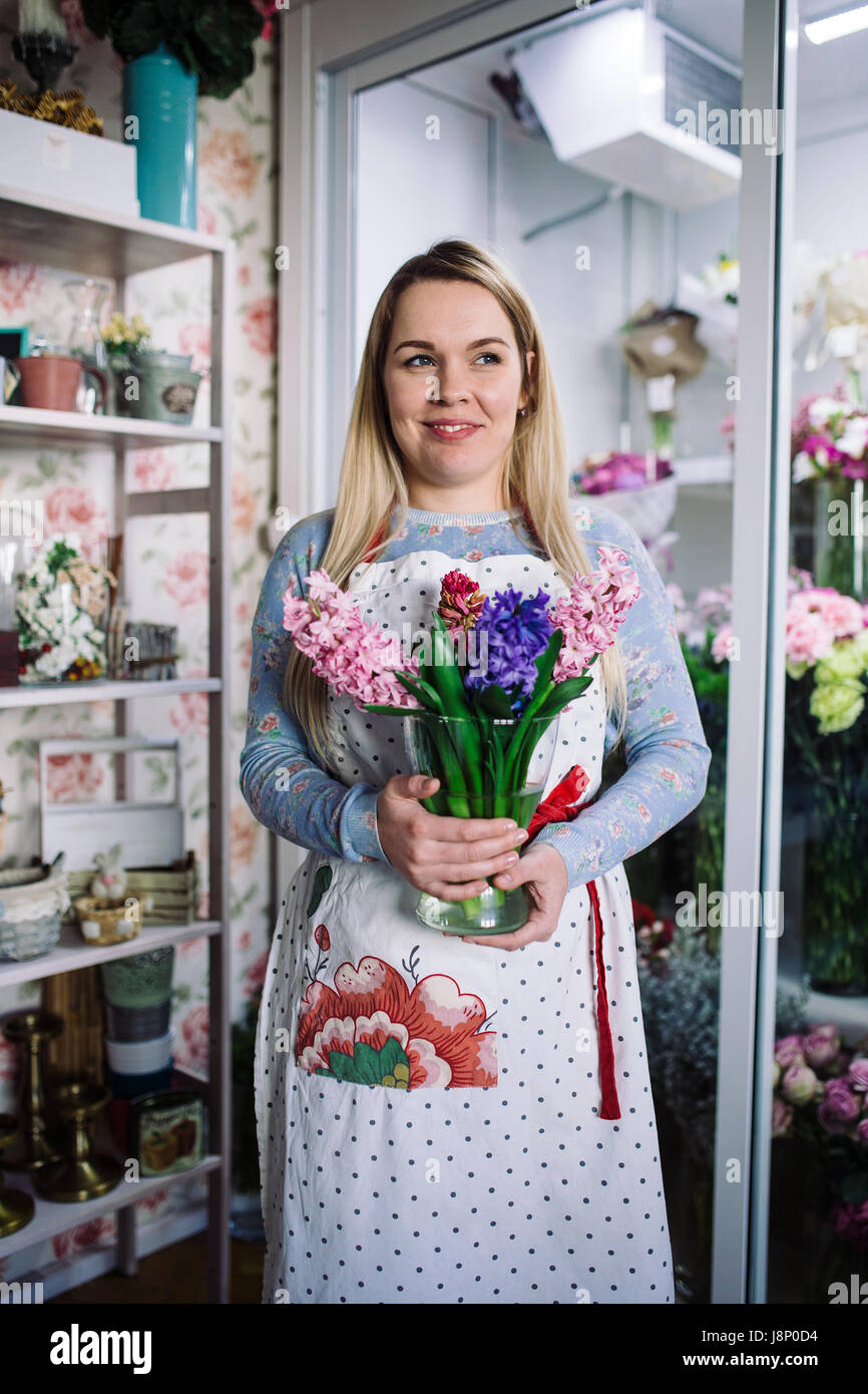 woman florist holding bouquet of hyacinth indoor in flower shop Stock ...