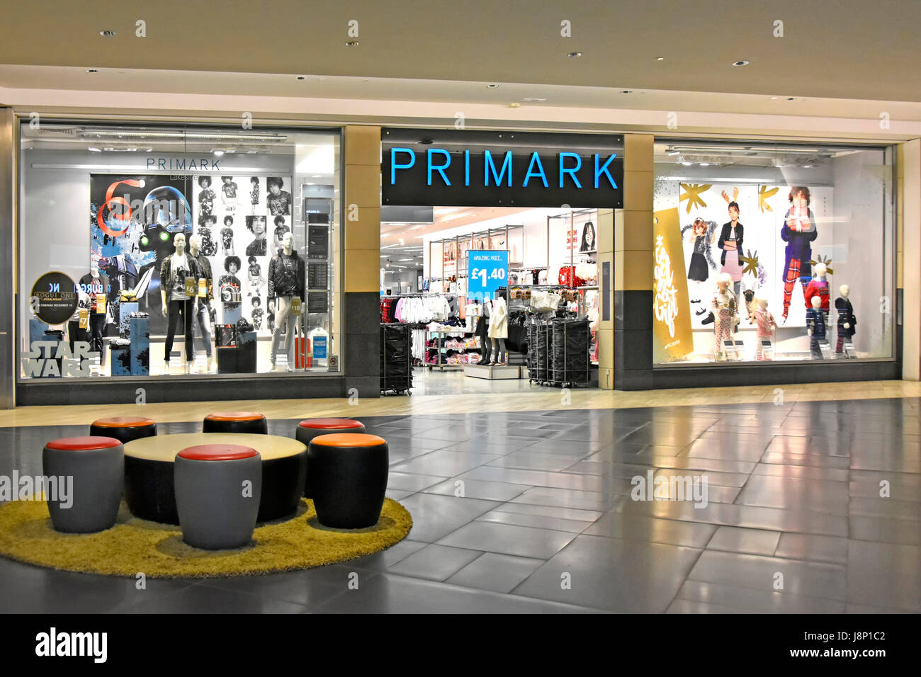 Early morning view of a quiet Primark store entrance in Intu indoor shopping mall Lakeside shopping centre Thurrock Essex England with window displays Stock Photo