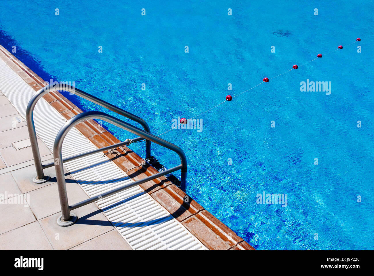 Ladder of pool and rope with buoys of hotel outdoor swimming pool Stock ...