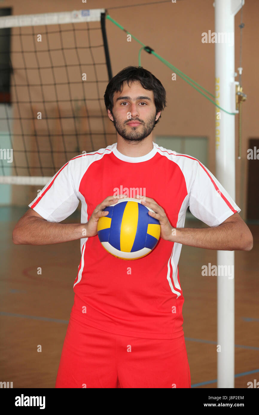 Boys playing volleyball inside hi-res stock photography and images - Alamy