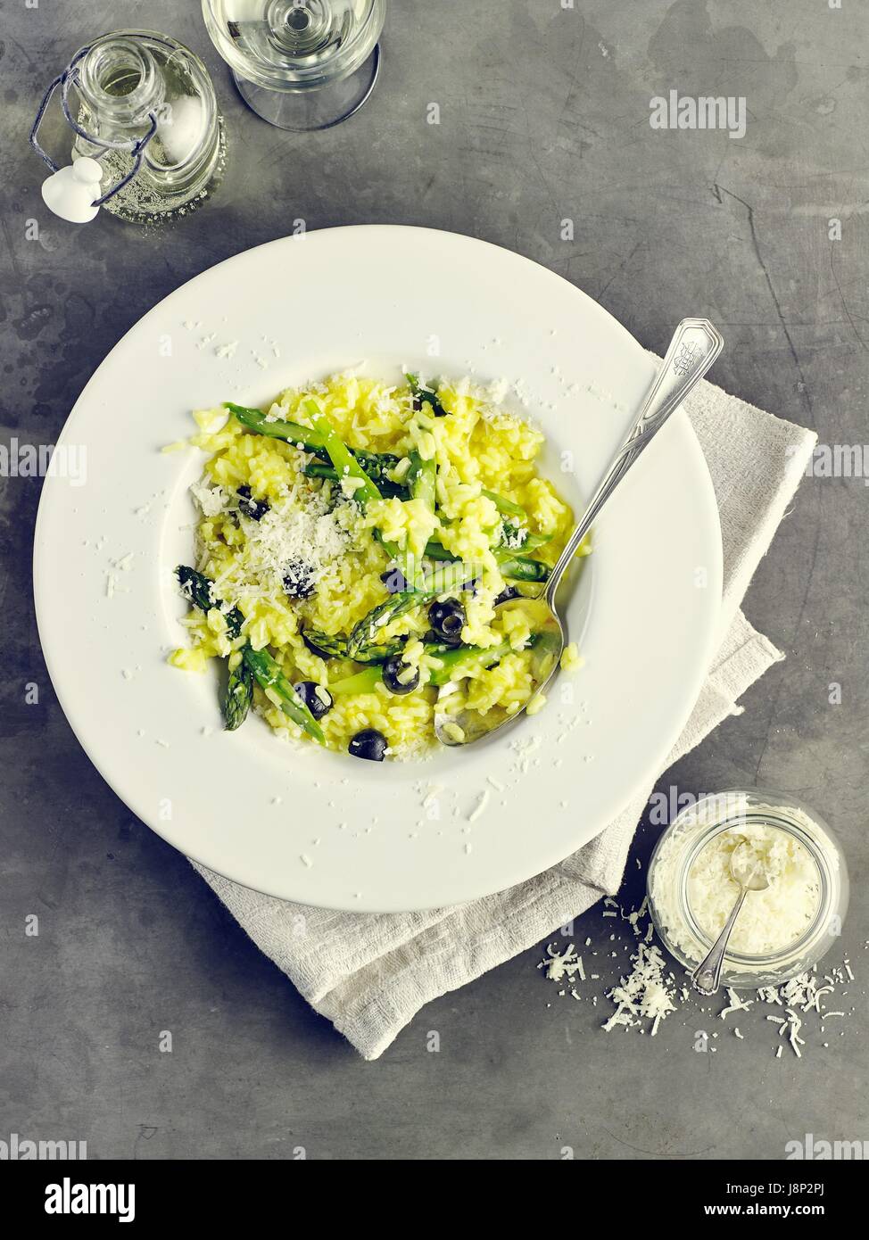 Risotto Milanese with green asparagus Stock Photo