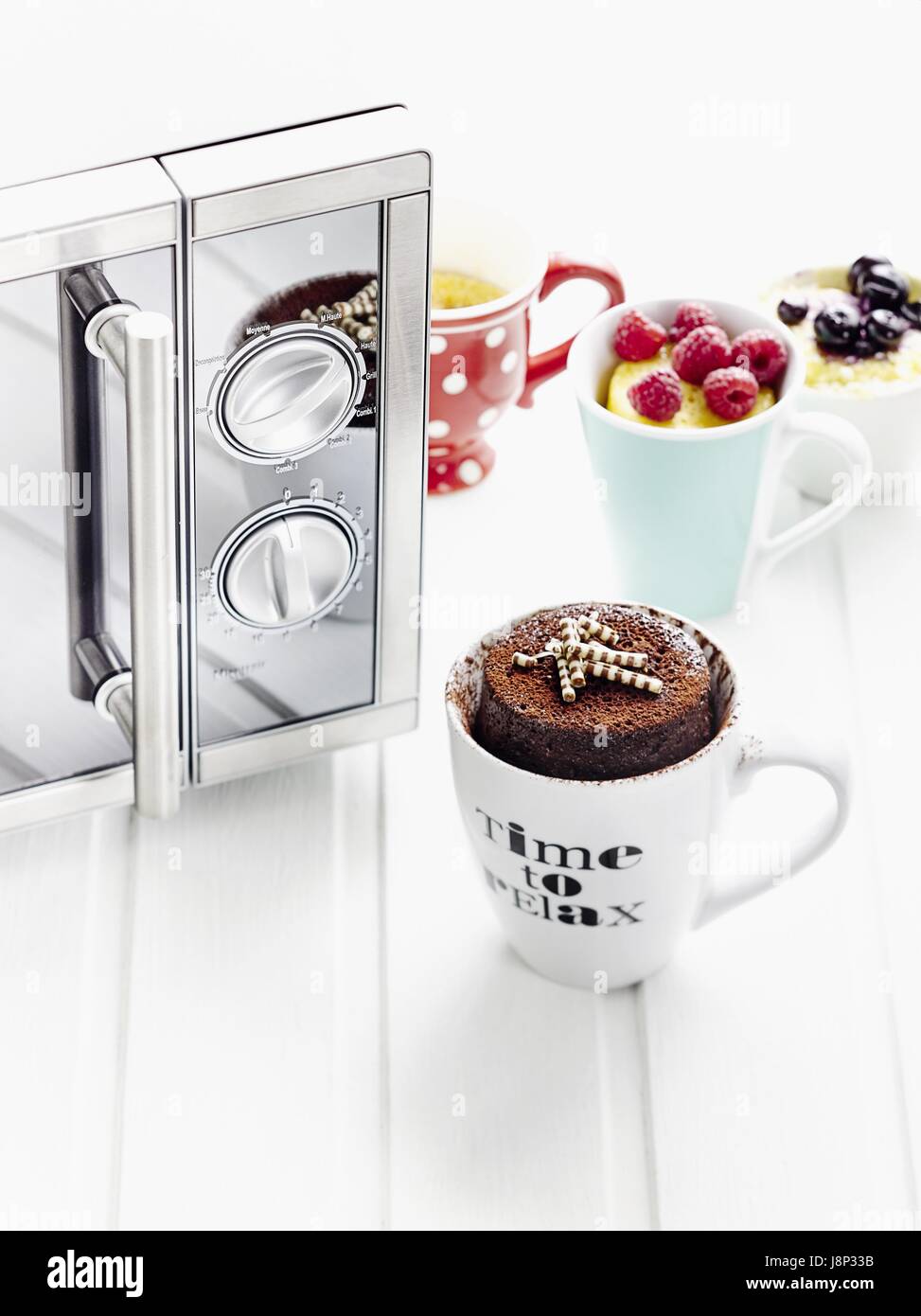 Mug cake variations (microwave Stock Photo Alamy