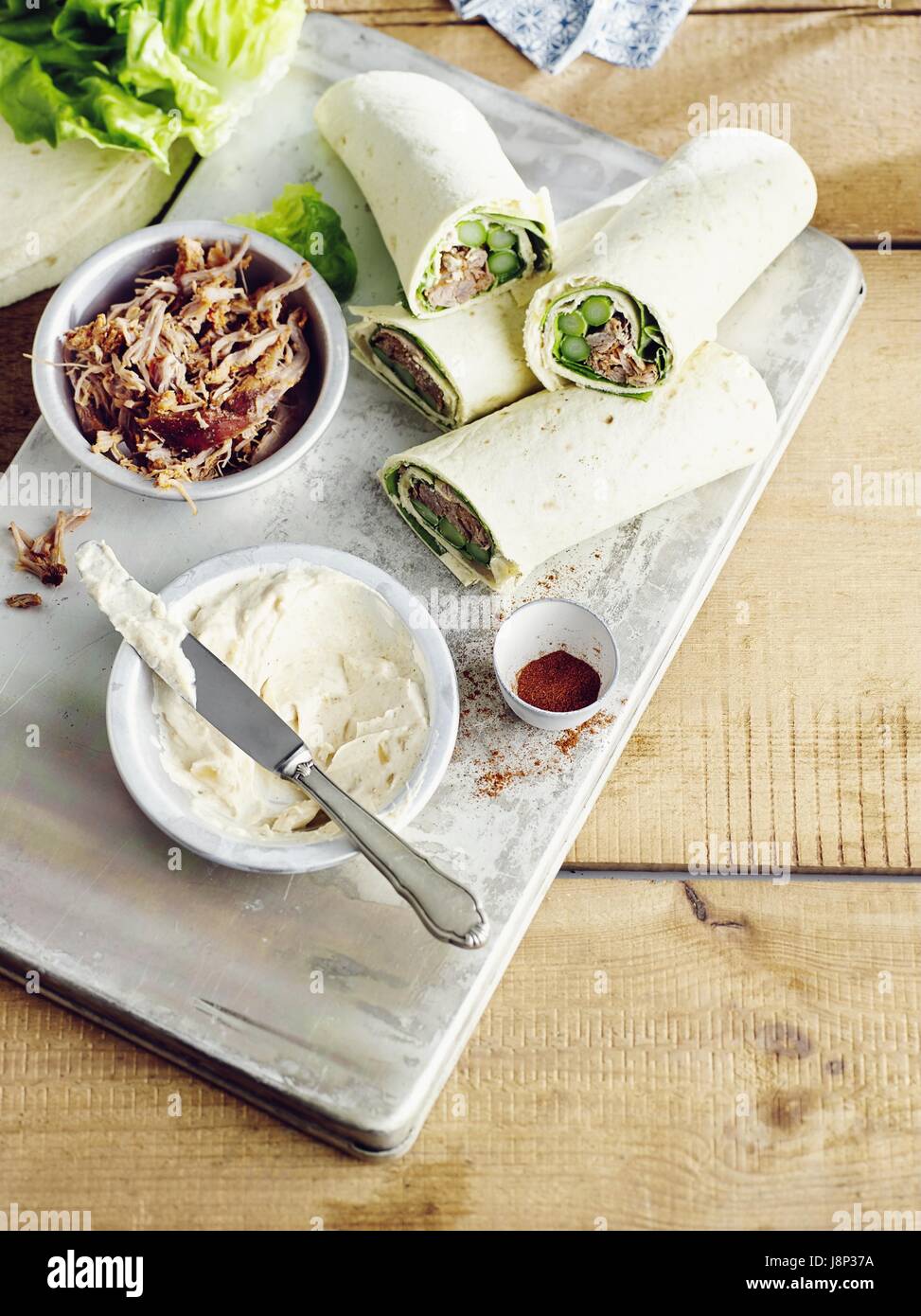 Wraps filled with asparagus and pulled turkey Stock Photo