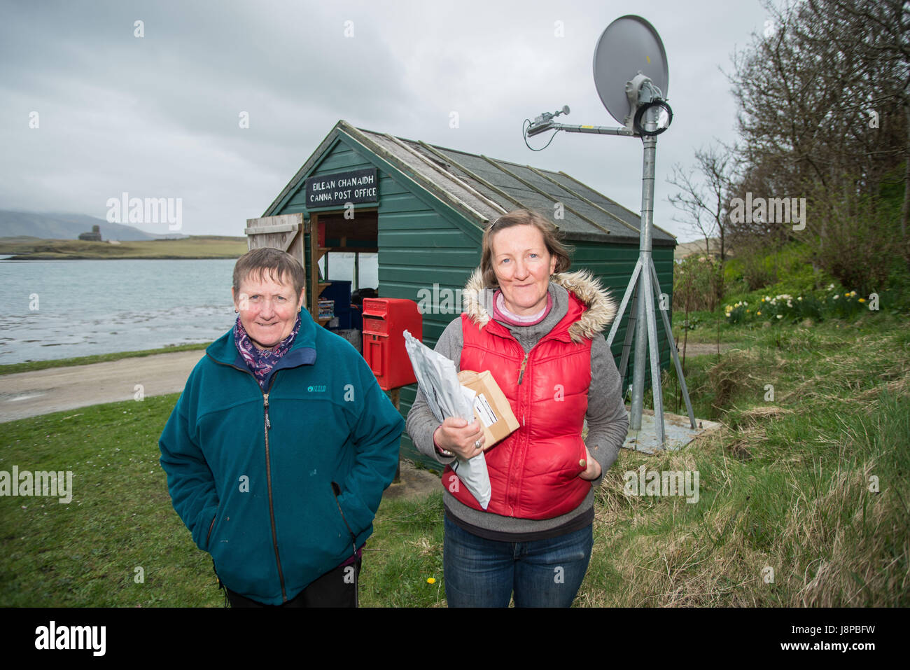 Winefride MacKinnon (left) and her sister Ishbel outside the post office on the Island of Canna, inner Hebrides  Scotland Stock Photo