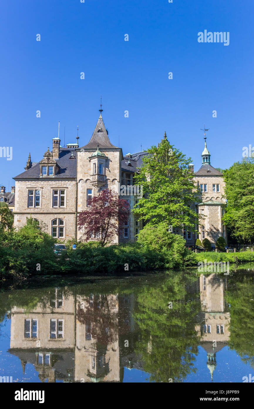 Towers of Castle Buckeburg in Germany with reflection in the water Stock Photo