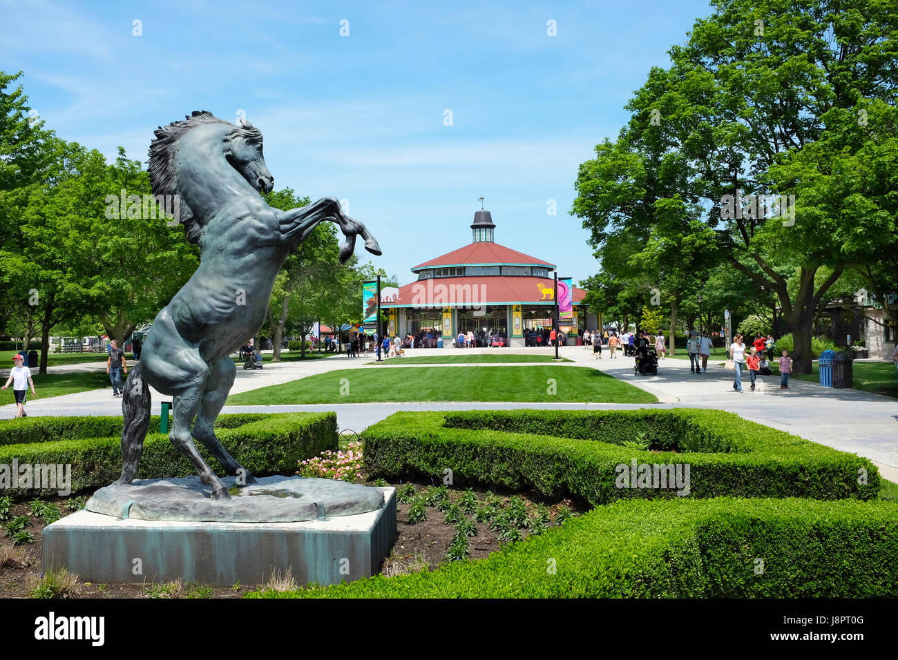 BROOKFIELD, ILLINOIS - MAY 27, 2017: Horse Statue and Carousel at the Brookfield Zoo The ride is popular attraction of the park with families and chil Stock Photo