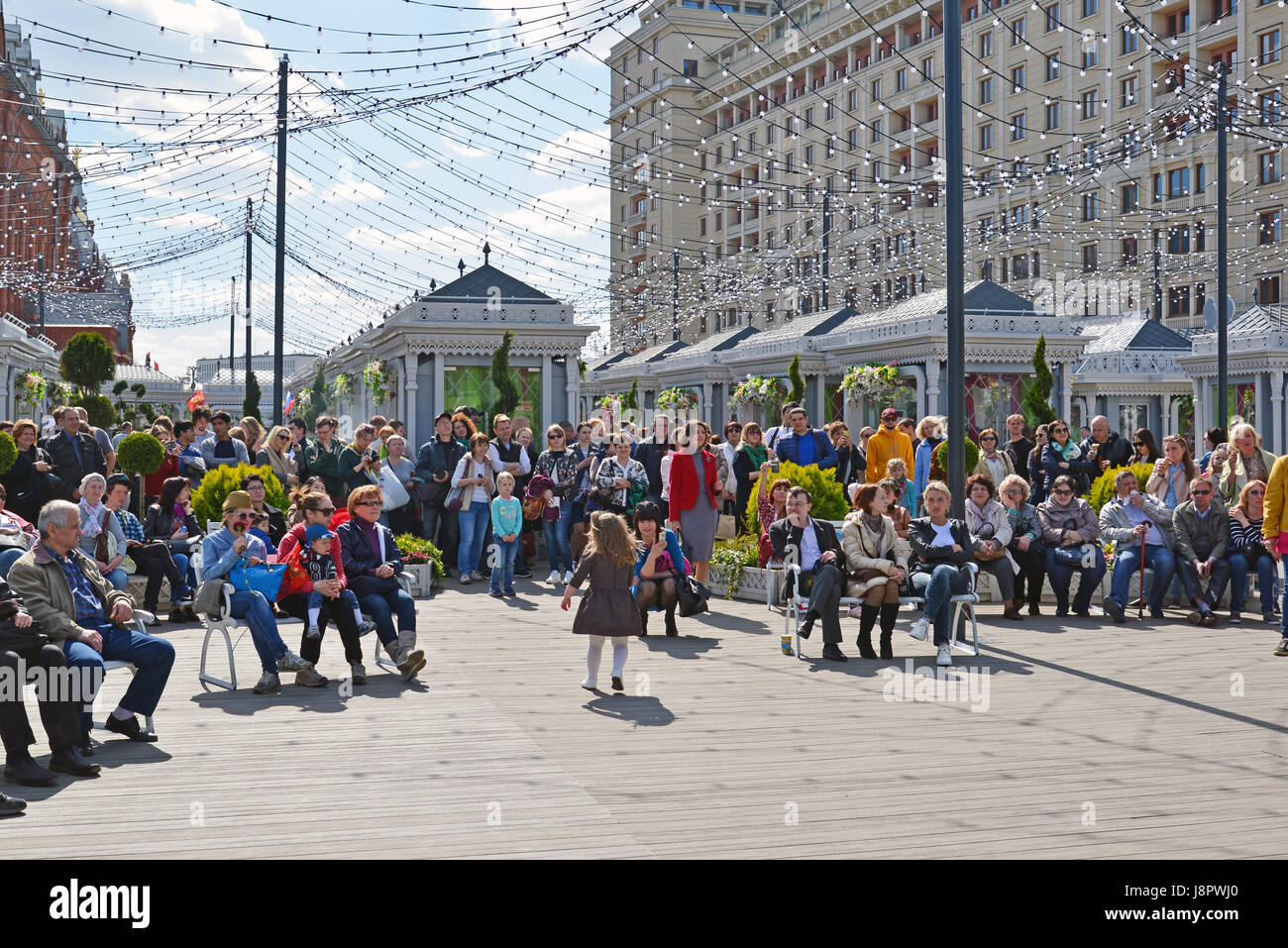 Moscow, Russia - may 06.2017. People listen to music at festival acappella Moscow Spring on Revolution square Stock Photo