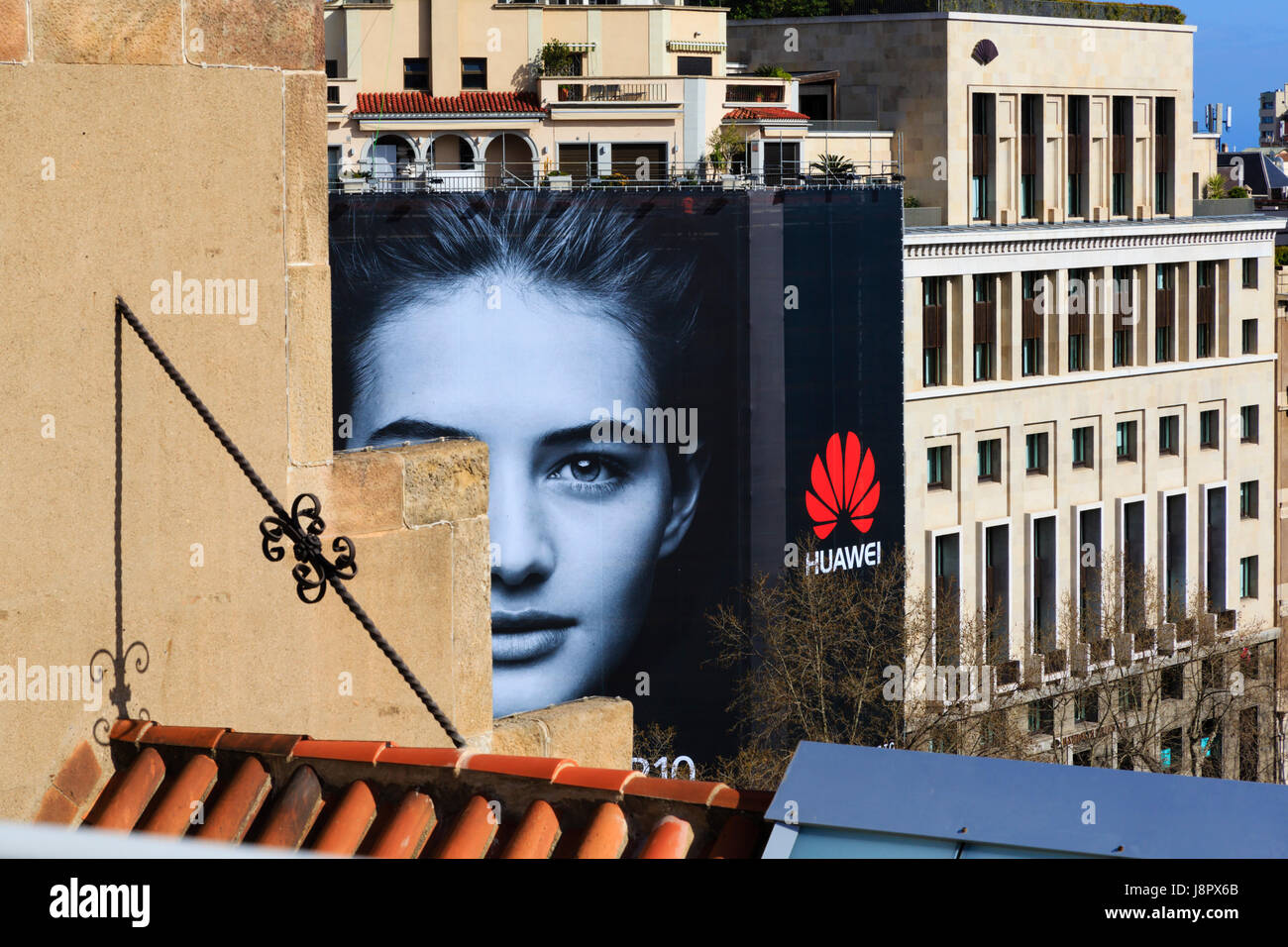 Massive advertising screen on scaffolding for Huawei mobile phone, Barcelona, Catalunya, Spain Stock Photo