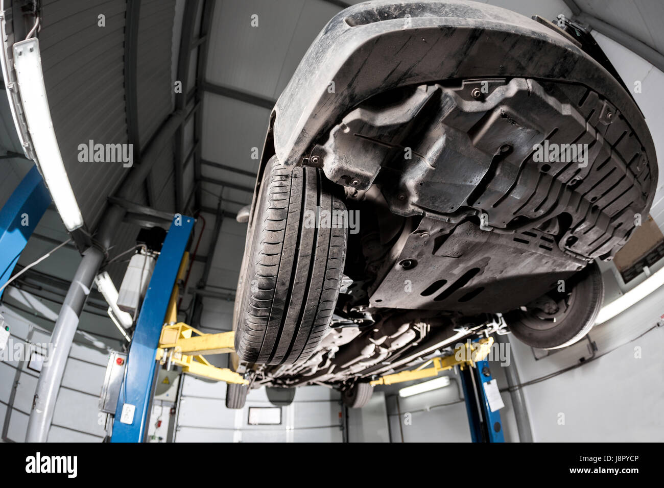 Auto view from the bottom. front car suspension. the garage mechanic