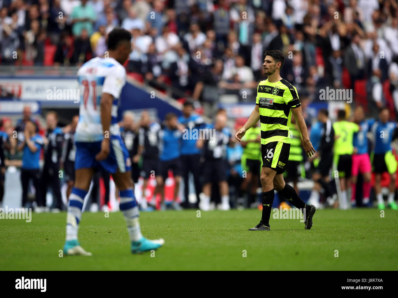 Reading's Jordan Obita walks back after missing in the penalty shoot out as Huddersfield Town's Christopher Schindler walks up to take his during the Sky Bet Championship play-off final at Wembley Stadium, London. Stock Photo