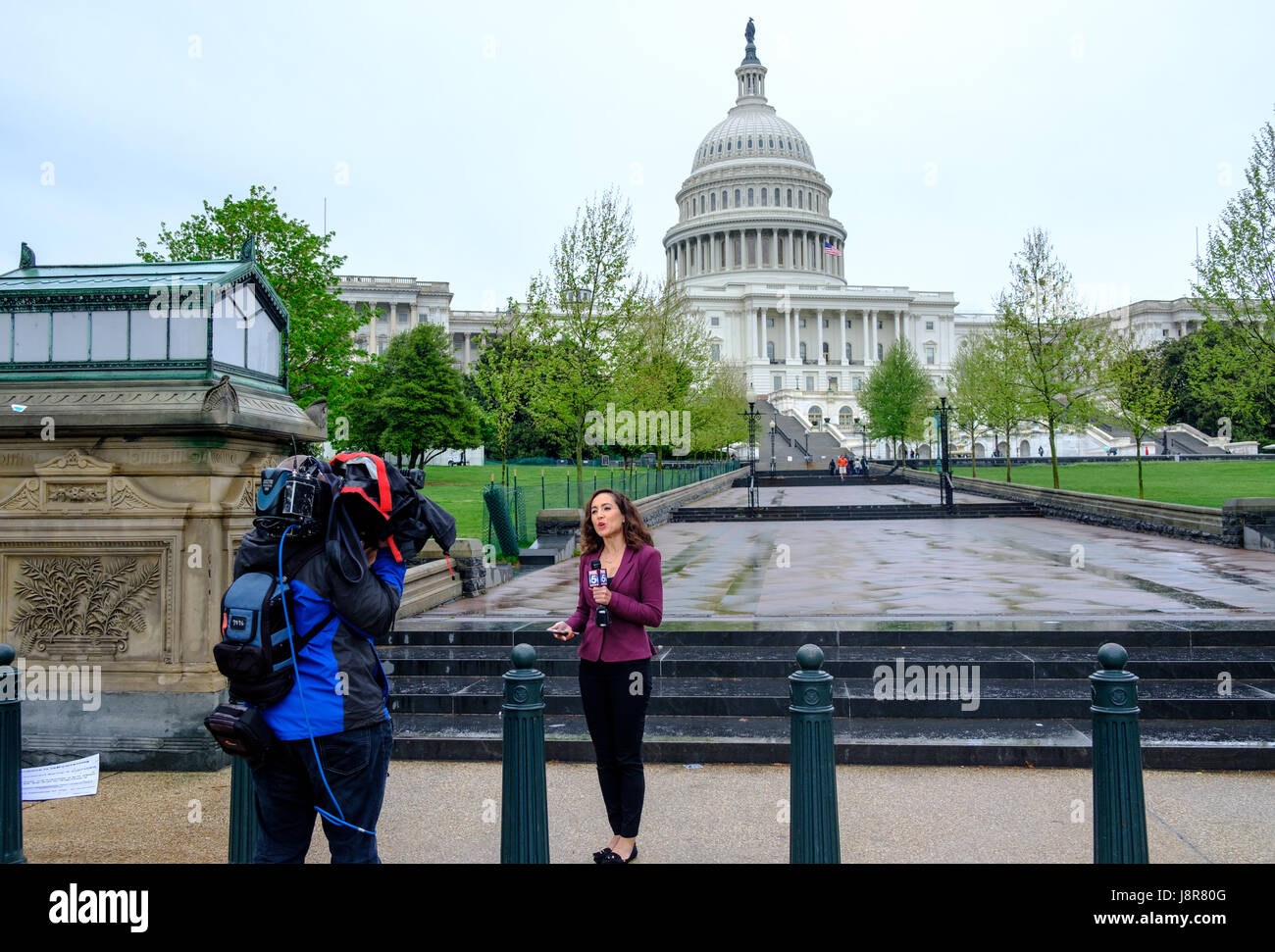 Fox News reporter broadcasting in front of the United States Capitol,  Washington DC, USA, April 22, 2017. Stock Photo