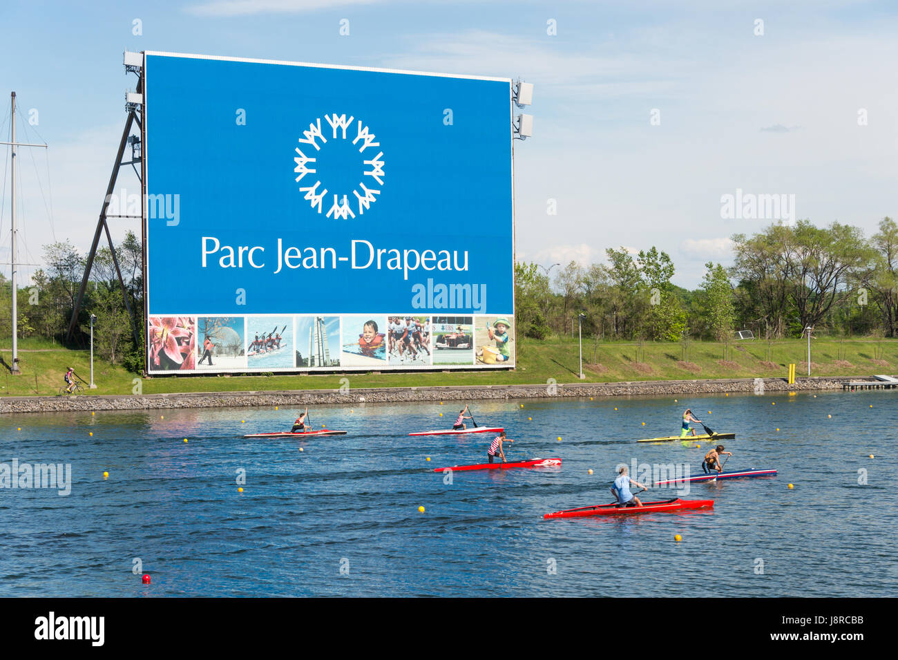 Montreal, CA - 29 May 2017: Kayakers in front of Parc Jean Drapeau sign Stock Photo