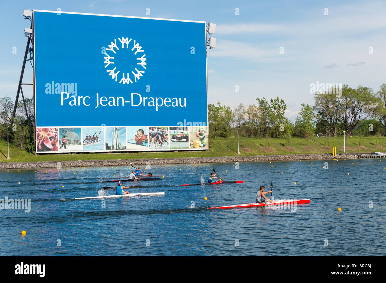 Montreal, CA - 29 May 2017: Kayakers in front of Parc Jean Drapeau sign Stock Photo