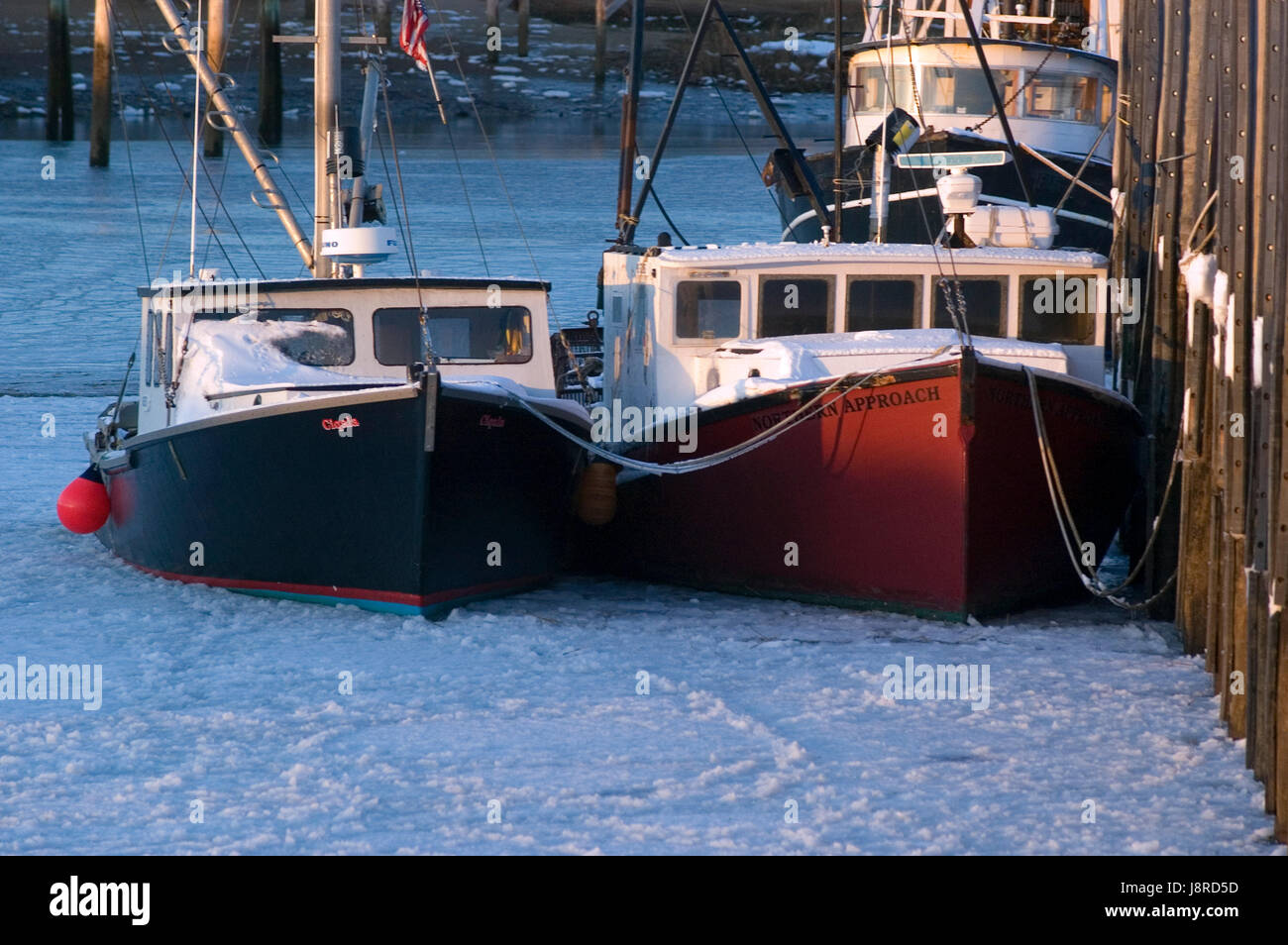Fishing Boats frozen in the ice at Rock Harbor, Orleans, Massachusetts